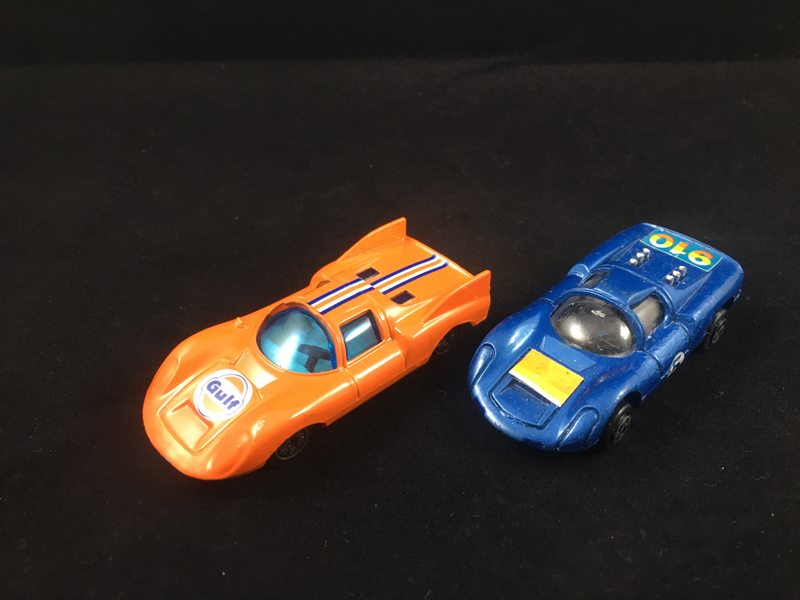 Porsche 910s: Orange one by Yatming, Blue one by Xylmex. Yatming 910 only loosely looks like a 910 (which never ran with 917 fins). Xylmex 910 is a very nice model.